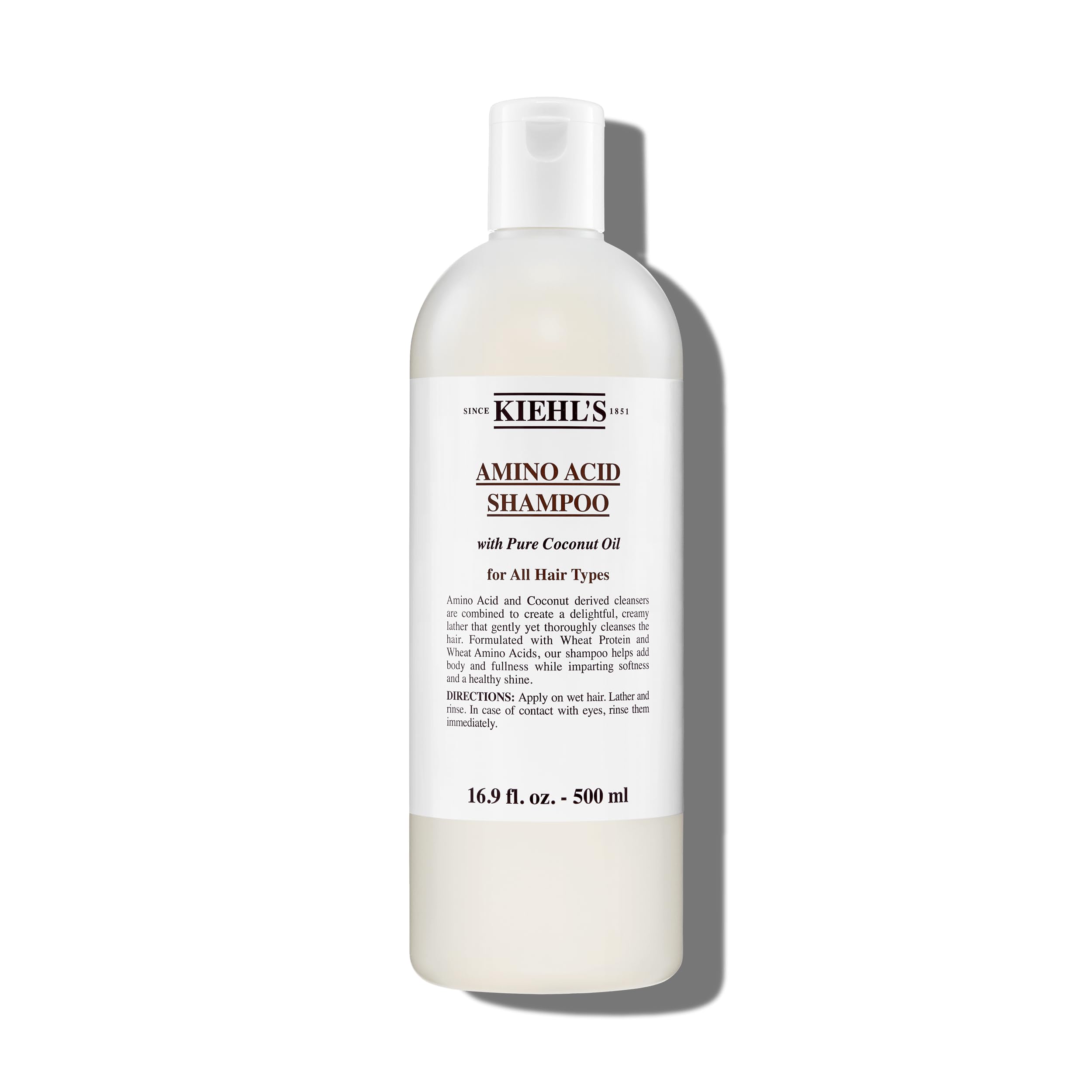 Kiehl's Amino Acid Shampoo bottle demonstrates a clarifying cleanse for light, refreshed hair.