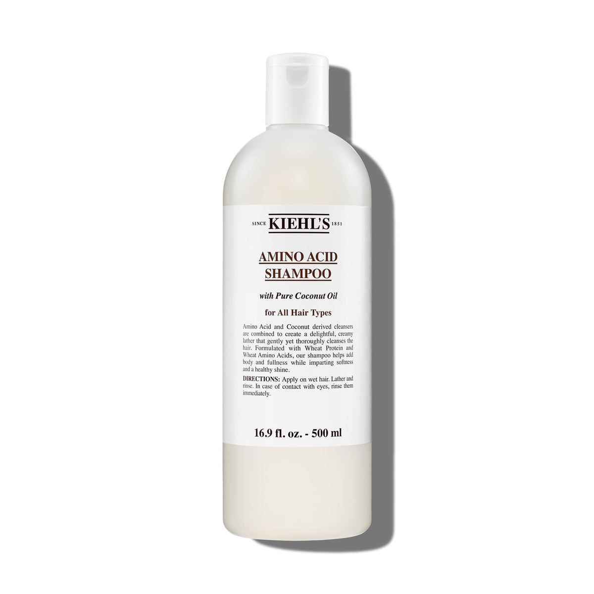 Kiehl's Amino Acid Shampoo bottle demonstrates a clarifying cleanse for light, refreshed hair.