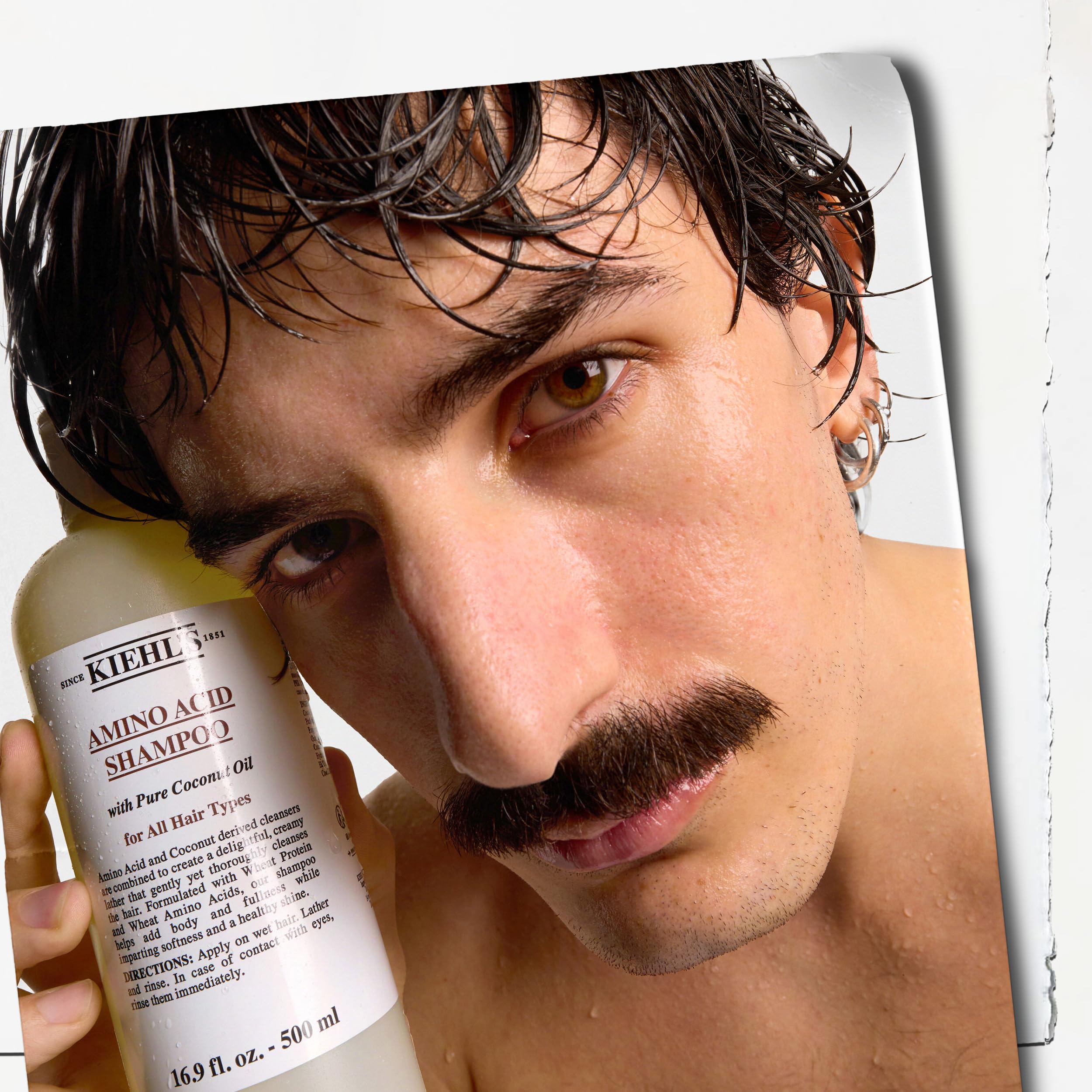 Paraben-free badge on the Kiehl's Amino Acid Shampoo bottle.