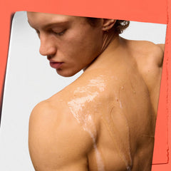Kiehl's Grapefruit bottle close-up emphasizes aromatic scent and cleansing formula.