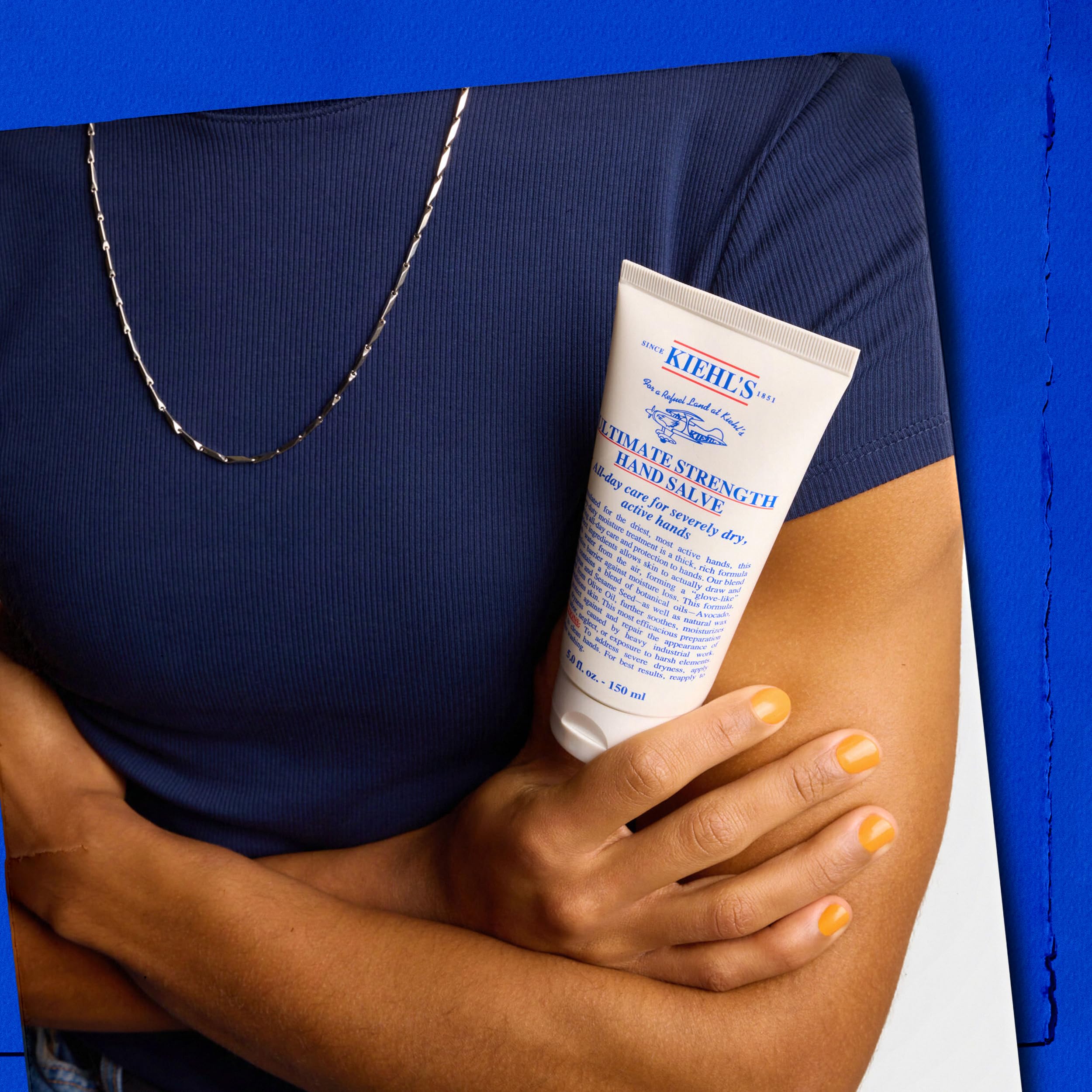 Kiehl's Ultimate Strength Hand Salve with shea butter on dry hands.