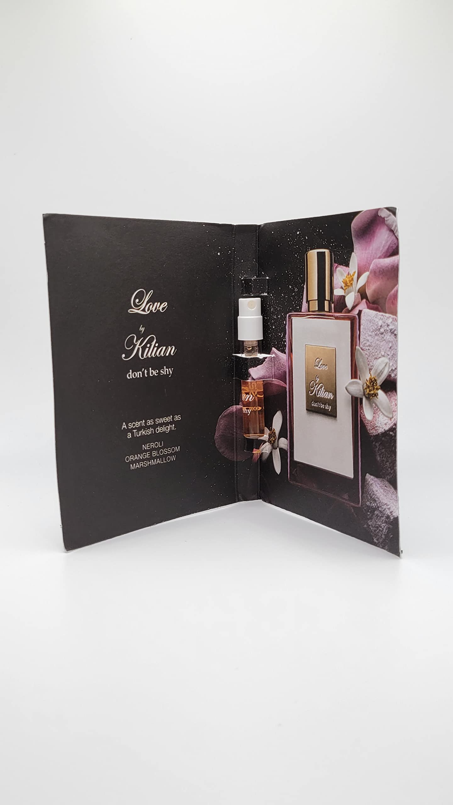 Kilian Love Don't Be Shy bottle side view highlighting sleek packaging and accessible travel size.