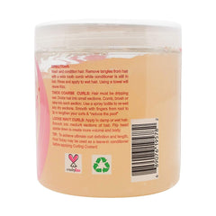 Kinky Curly applying custard to damp hair for styling
