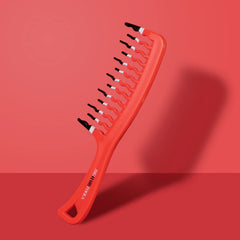 KISMETICS orange shower comb distributes conditioner evenly while detangling.