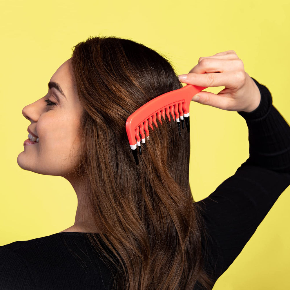 KISMETICS orange gift-ready packaging with wide-tooth comb for hair care gifts.