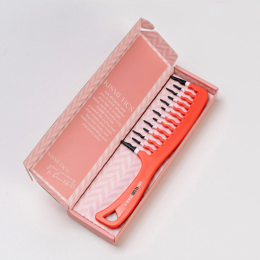 KISMETICS orange wide-tooth comb used on long thick hair for easier detangling.