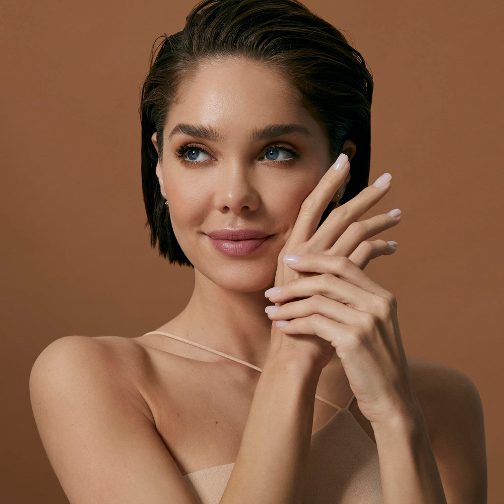 KISS nude gel nails on fingertips showing seamless color blend.