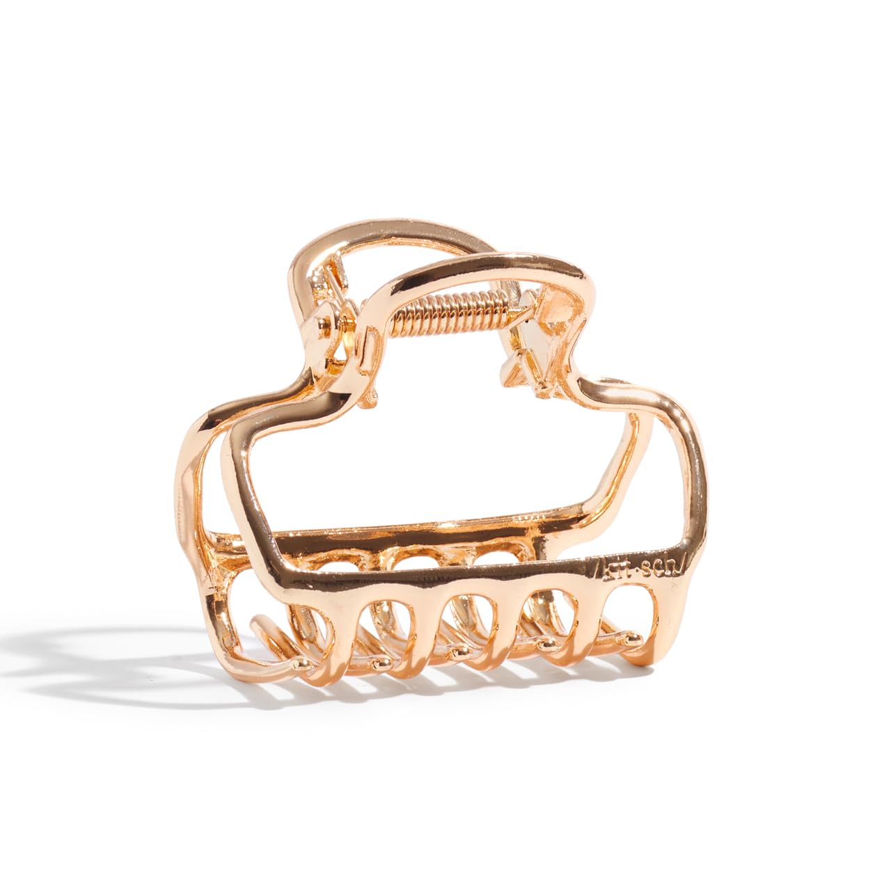 Kitsch gold-tone hair clip adds subtle shine to any hairstyle.
