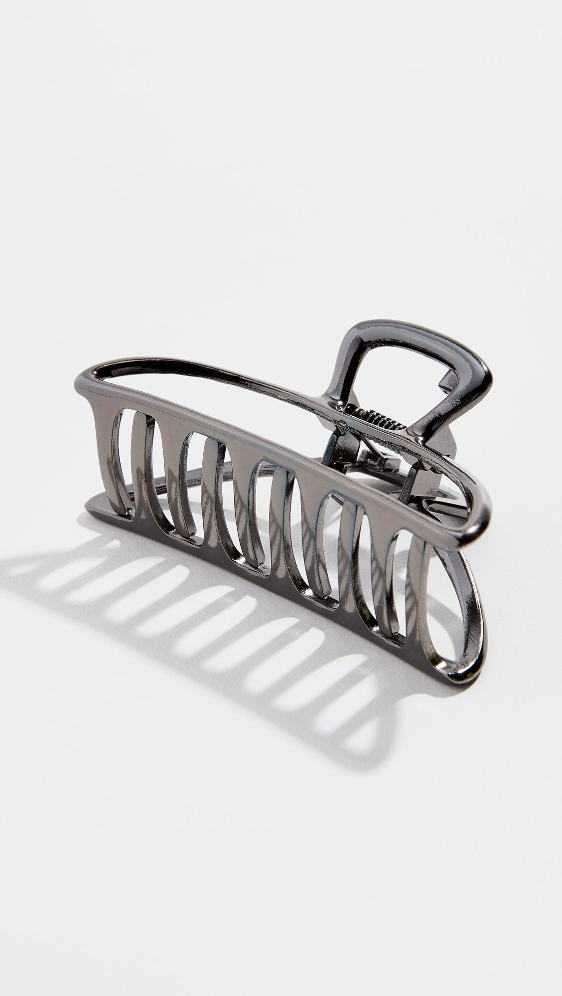 Kitsch hematite metal hair clip with outfit emphasizes chic practicality
