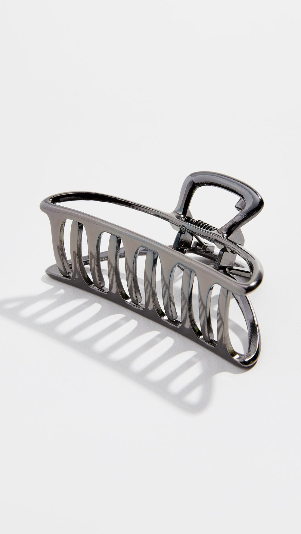Kitsch hematite metal hair clip with outfit emphasizes chic practicality