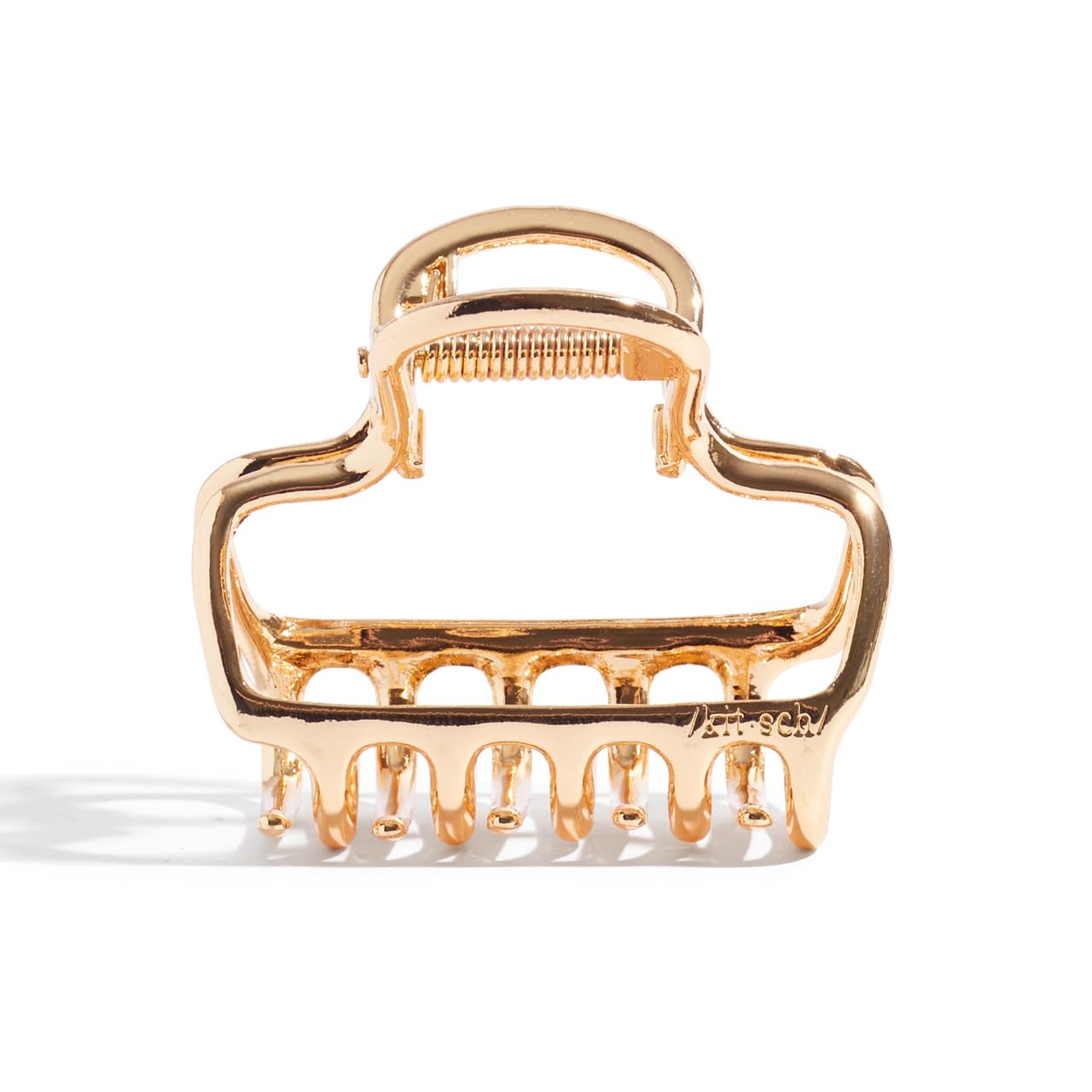 Kitsch metal claw clip delivers durable hold for daily wear.
