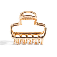 Kitsch metal claw clip delivers durable hold for daily wear.