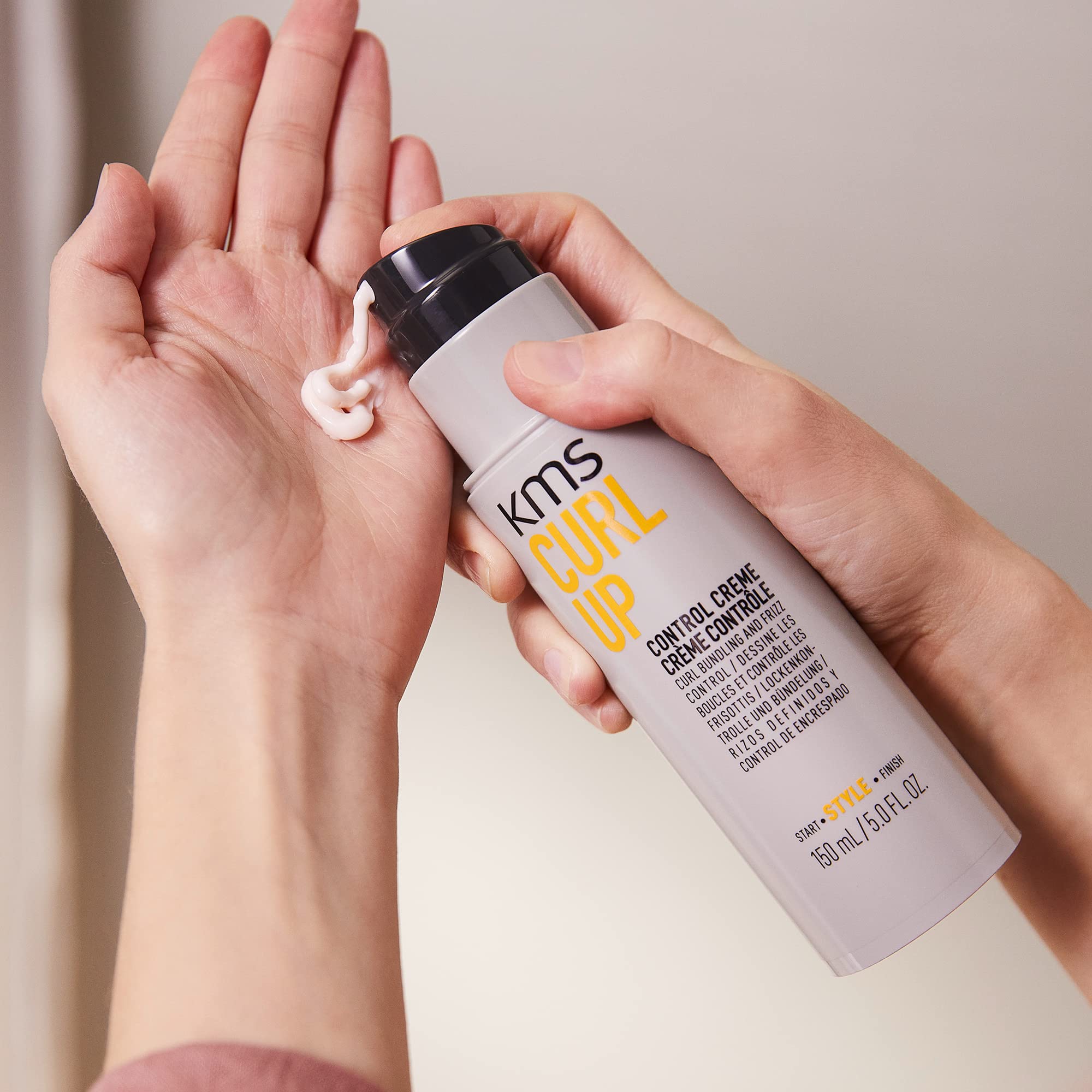 KMS Curlup Control Crème beside styling tools for routine.