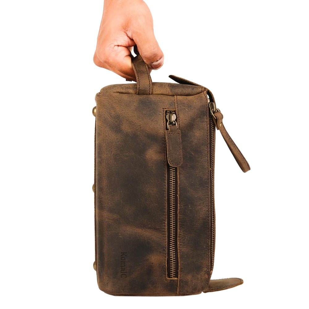 KomalC buffalo leather toiletry bag external pocket keeps razors organized.