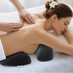 KONOVOLY face-down cushion shows non-slip bottom on a spa table