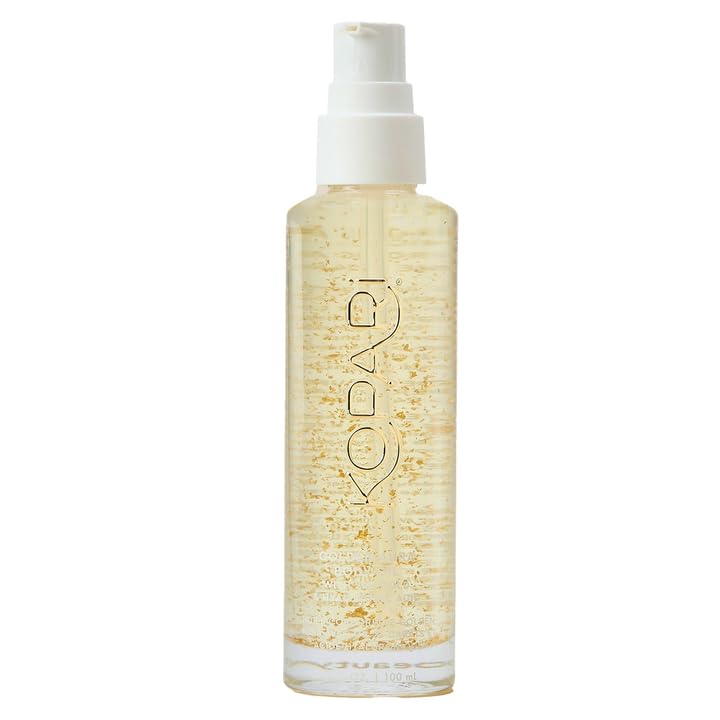 Kopari Golden Aura oil bottle with 24k gold detail for radiant hydration.
