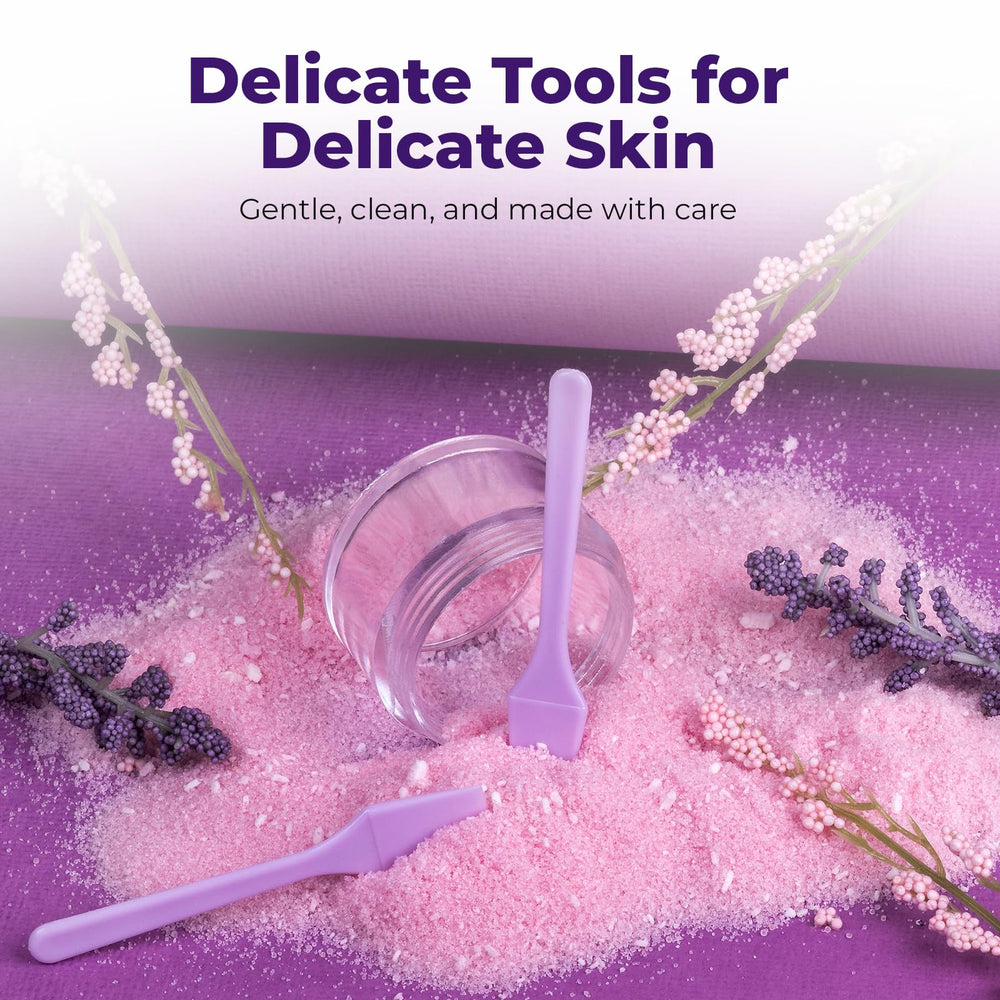 Rigid plastic Kopperko spatula for reliable cosmetic mixing.