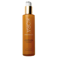 KORA Organics Turmeric Glow Foaming Cleanser bottle for a refreshing, brightening cleanse.