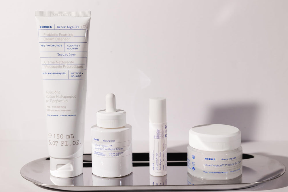 KORRES cleanser placed on a bathroom shelf with other skincare items.