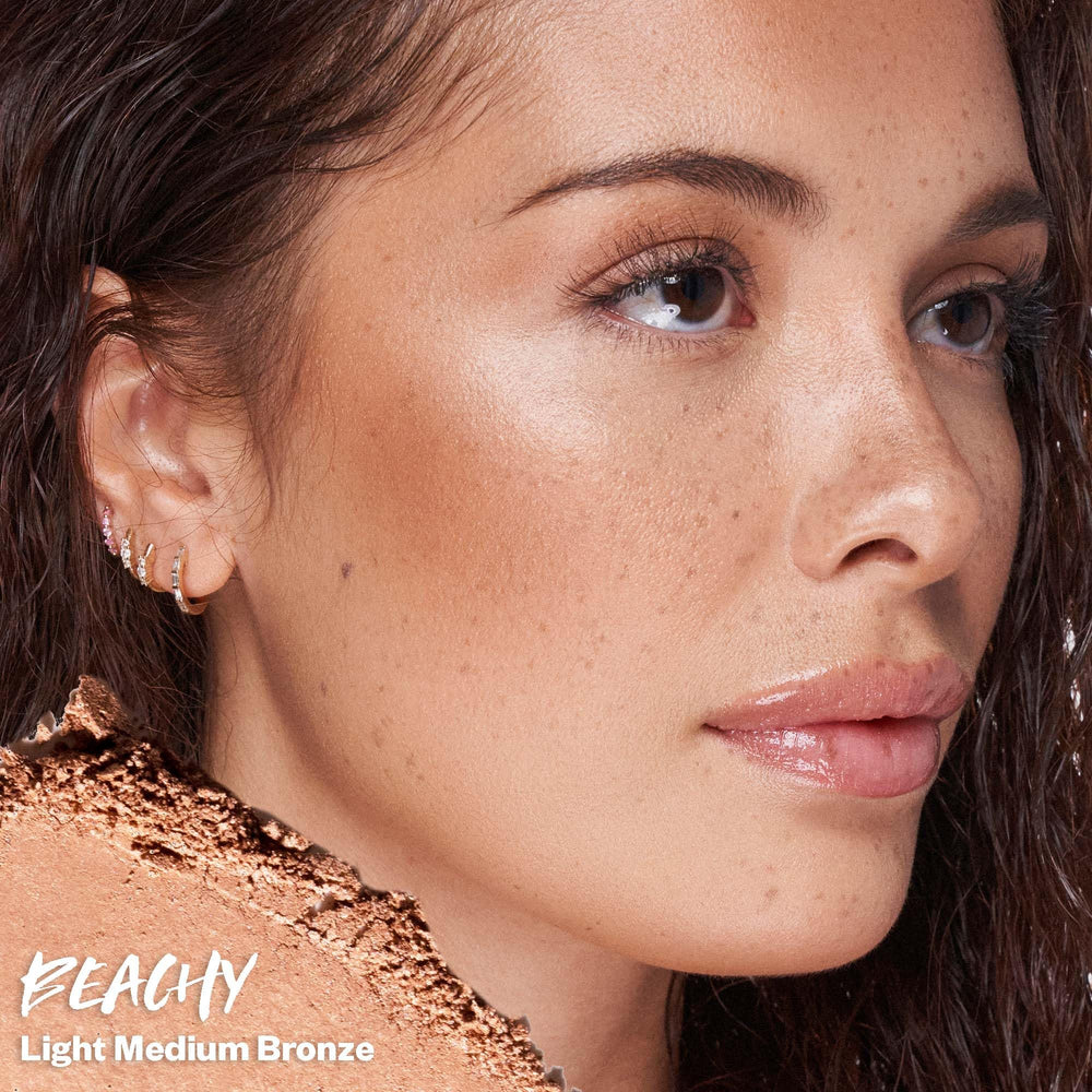 Kosas Sun Show Glowy Warmth Paradise bronzer swatch on skin for luminous warmth