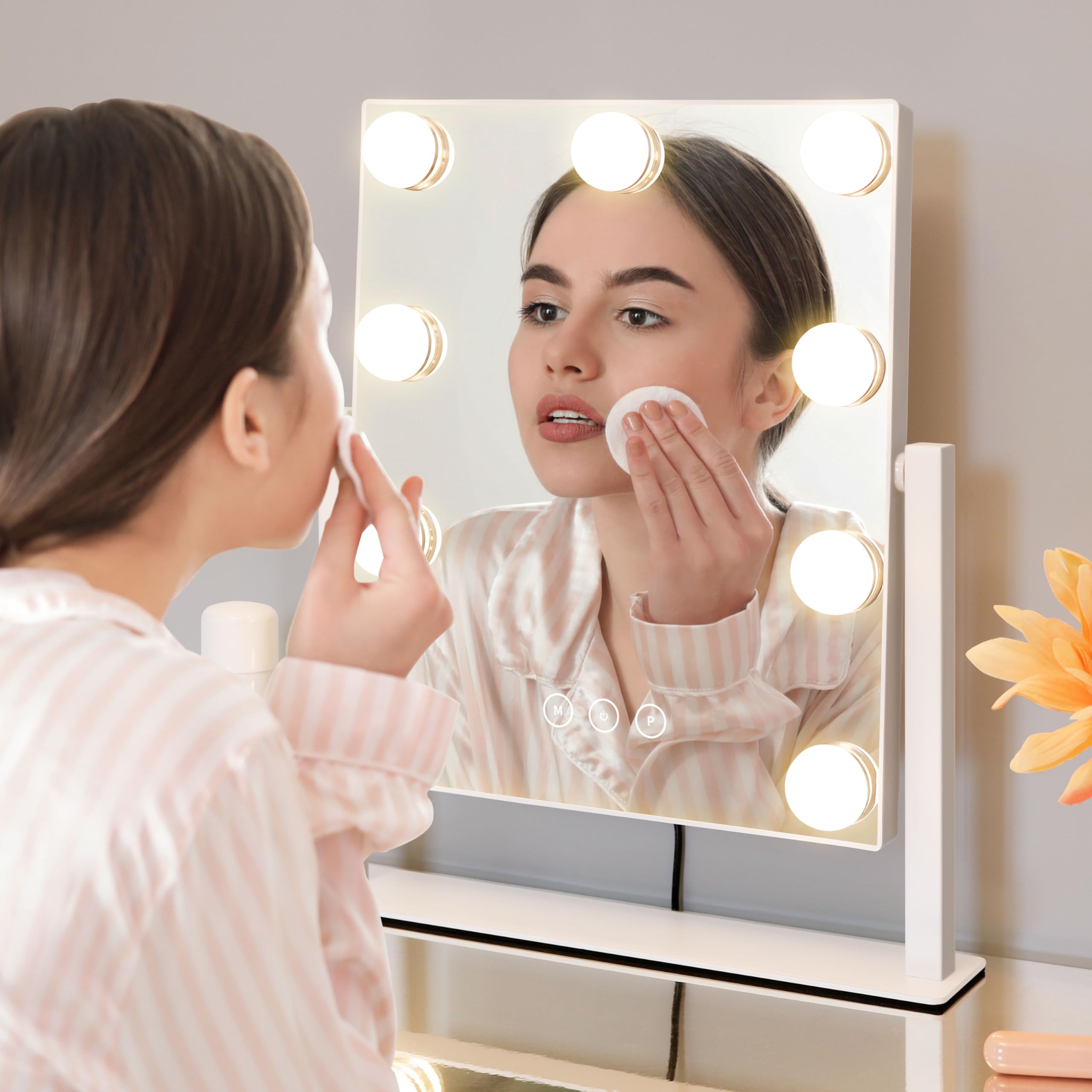 Kotdning vanity mirror uses touch controls and memory to recall last setting.