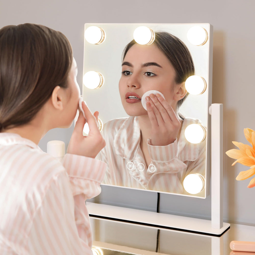 Kotdning vanity mirror uses touch controls and memory to recall last setting.