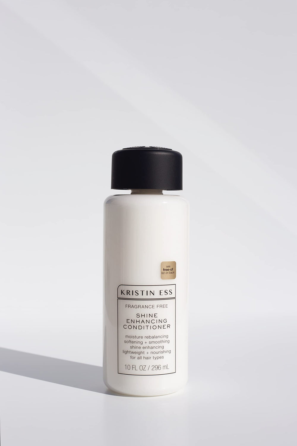 Close-up of Kristin Ess Fragrance Free Daily Shampoo label emphasizing fragrance-free and color-safe features