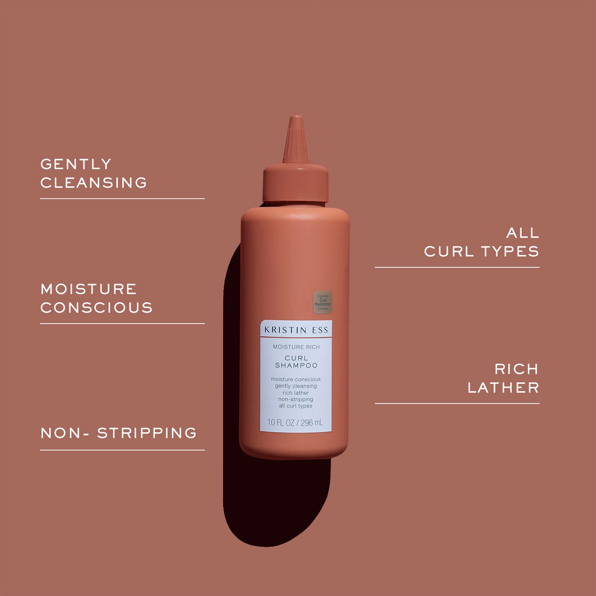 Kristin Ess Moisture Rich Curl Conditioner bottle aids detangling and frizz control.