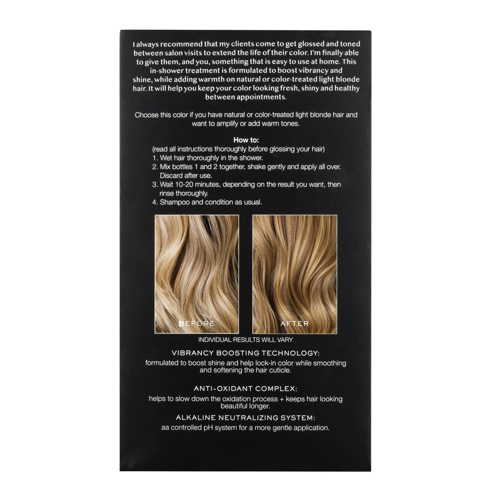 Applying Kristin Ess Hair Gloss Honey Latte from roots to ends