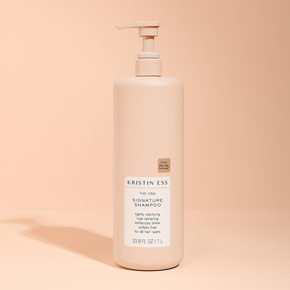 1-liter Kristin Ess Hair One Signature Shampoo bottle designed for long use.