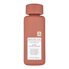 Kristin Ess Moisture Rich Conditioner bottle demonstrates hydrated, frizz-controlled curls.