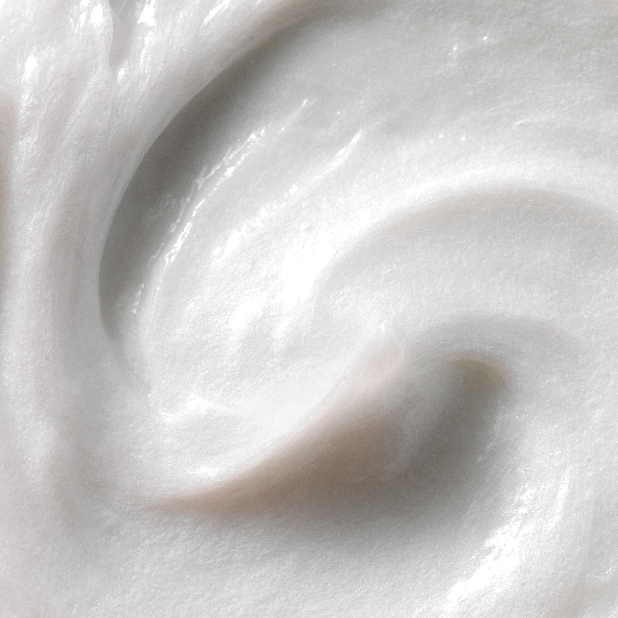 Creamy texture of Kristin Ess Moisture Rich Curl Conditioner highlighting hydration