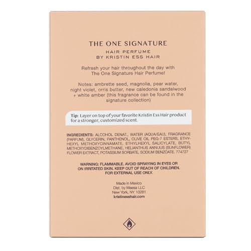 Kristin Ess One Signature Hair Perfume mist settling on dry hair for shine.