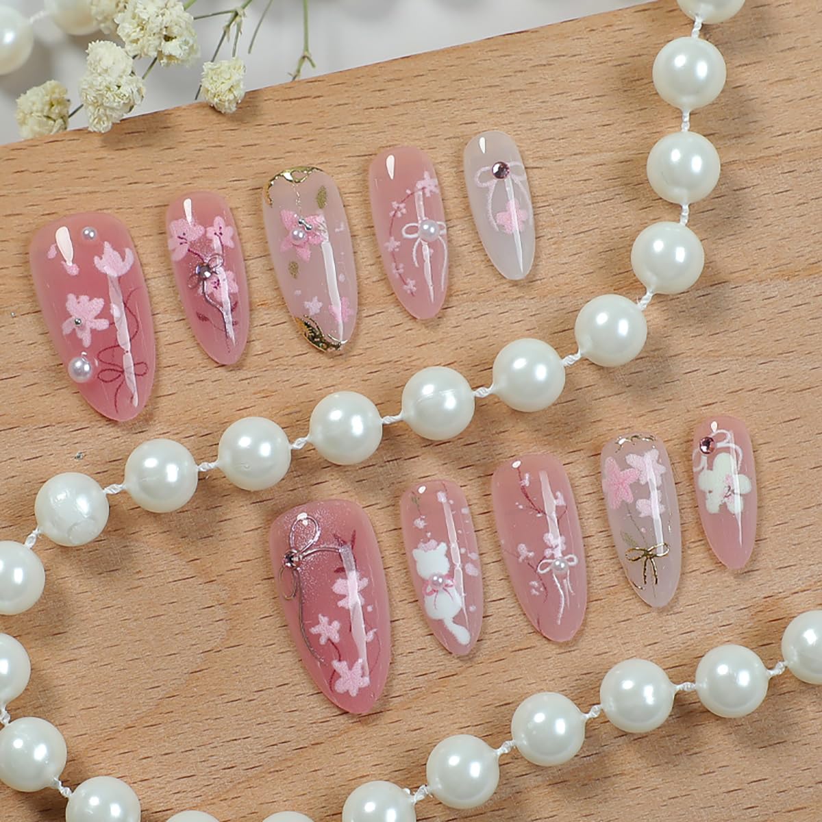 KRTBKR peach blossom design nails with 3D rhinestones for elegant party looks