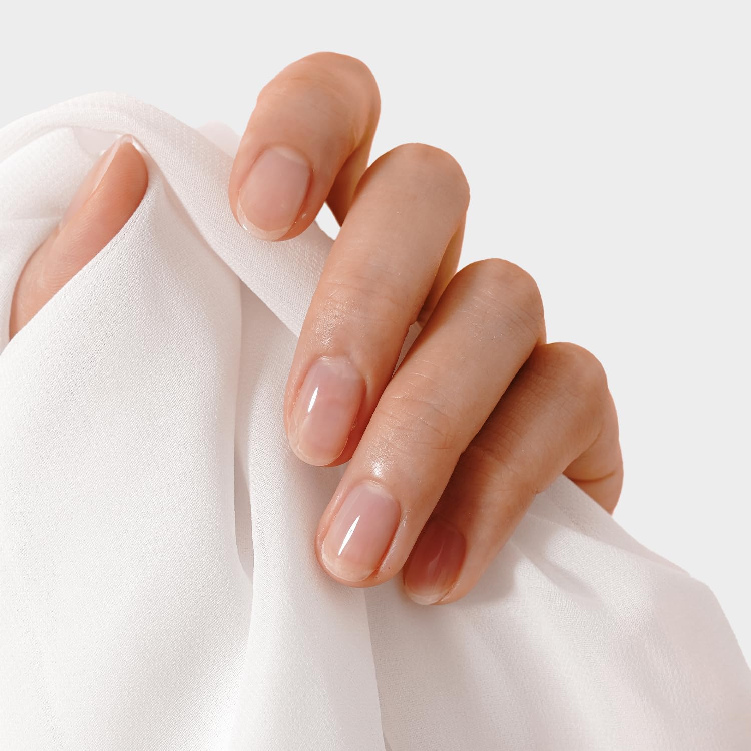 KUPA GelFinity gel base coat protects natural nails during gel wear.