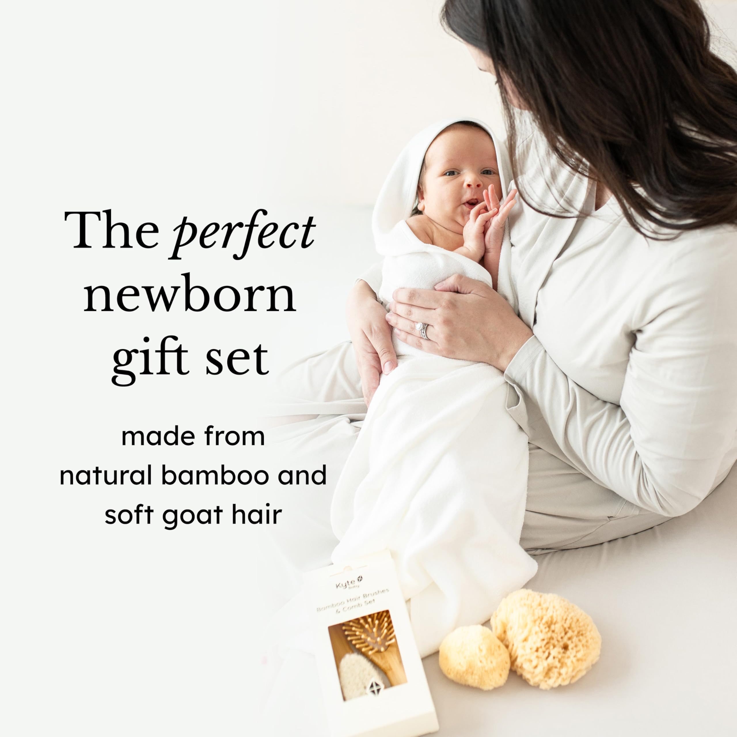 Kyte BABY goat hair brush in use on toddler's hair.