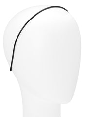 Diadema Twiggy delgada de L. Erickson, negro, perfil, sostiene el cabello ligero sin esfuerzo.
