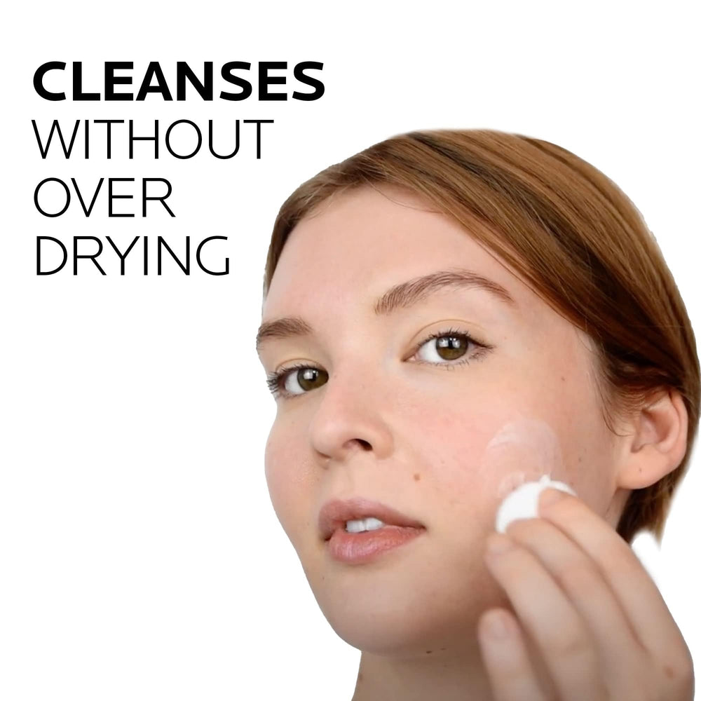 Cleansing face with fingertips using La Roche-Posay Toleriane cleanser.