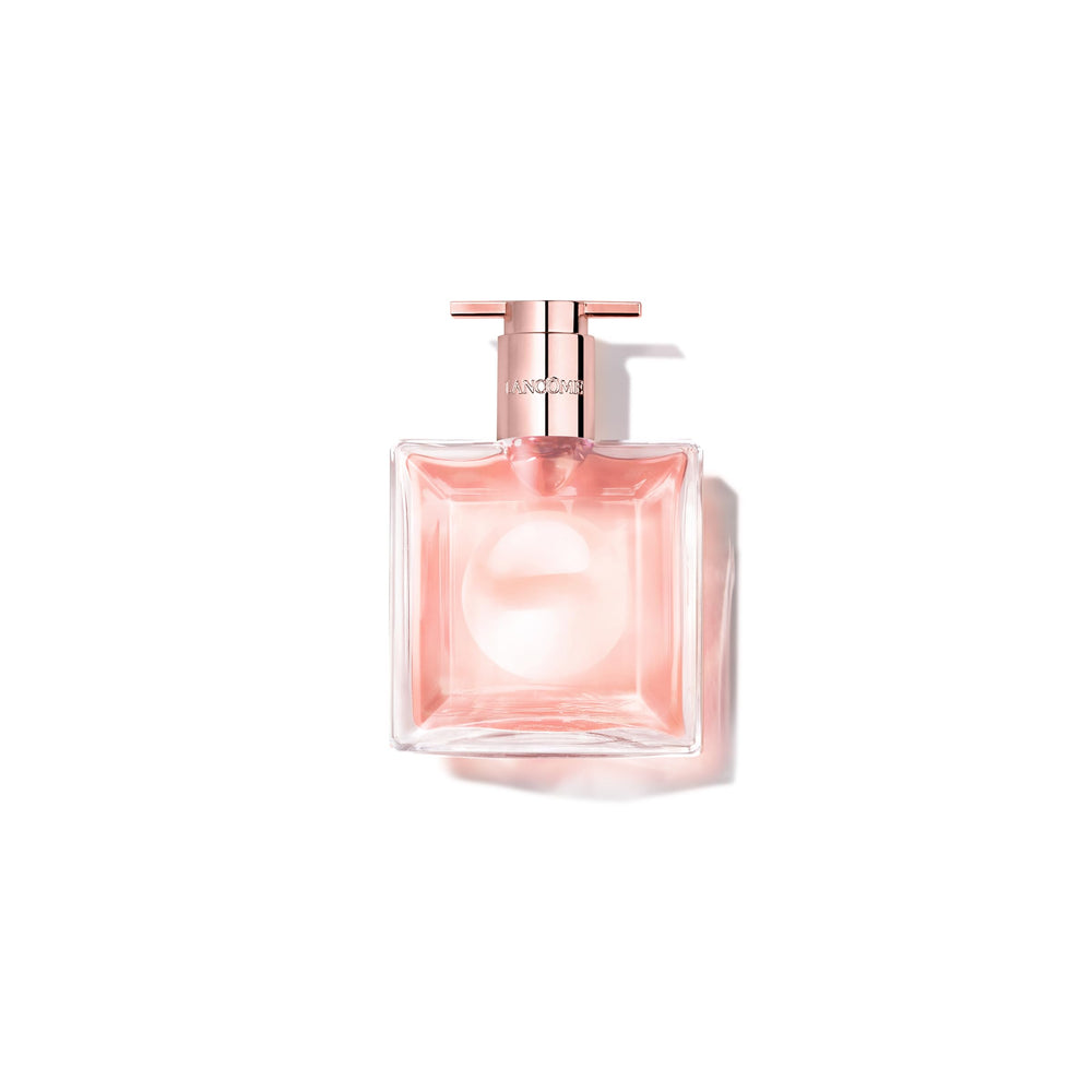 Lancôme Idôle bottle pour shows sleek, minimalist design for daily elegance.