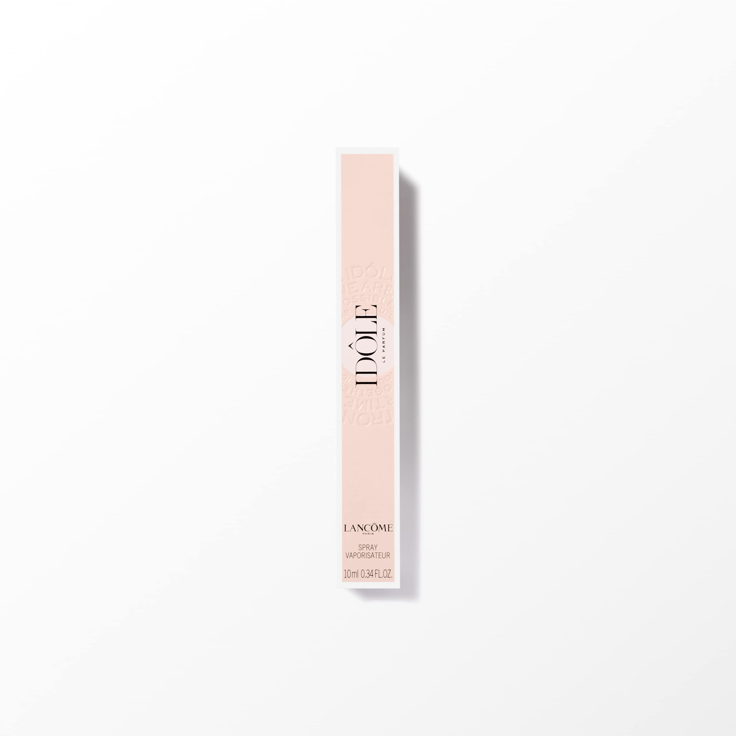 Lancome Idôle bottle on a pristine vanity reflecting timeless French elegance.