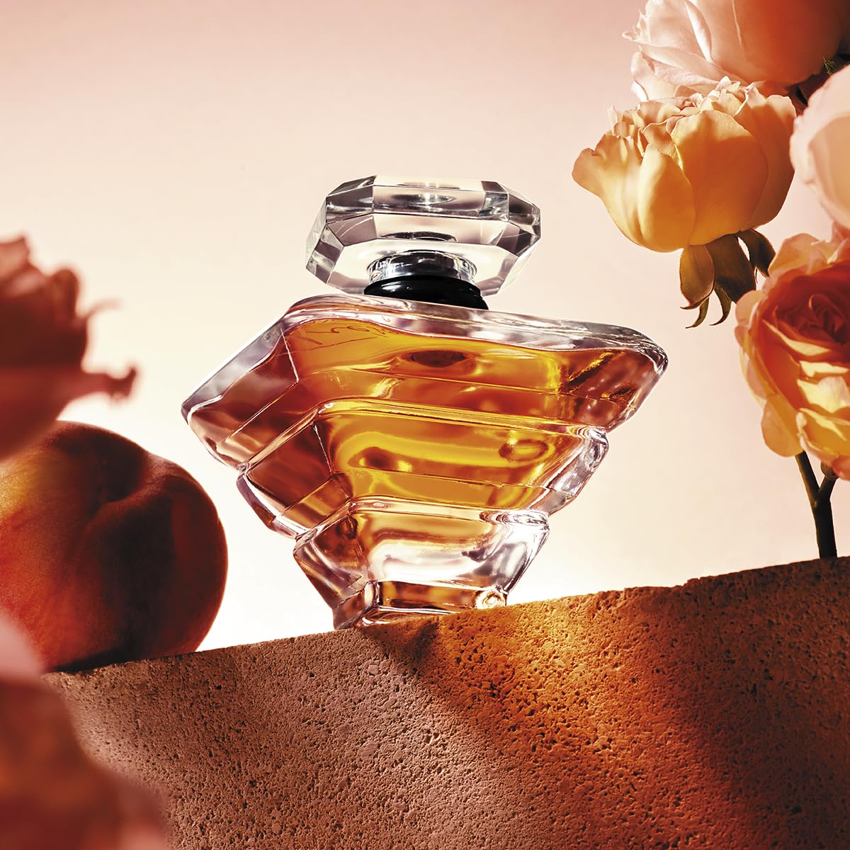 Lancôme Trésor diamond-shaped cap underlines luxury in every shelf.