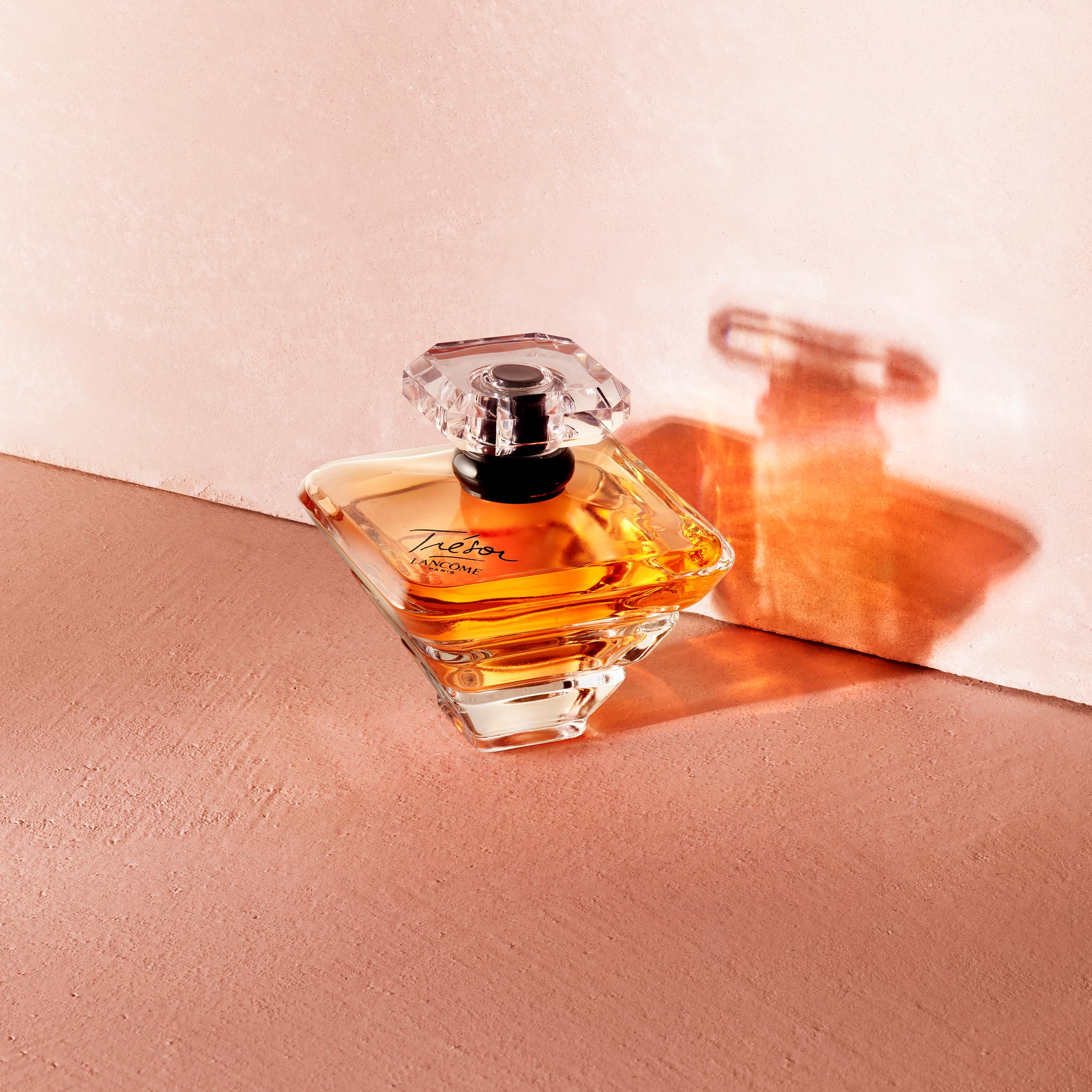 Lancôme Trésor golden juice glows inside the crystal bottle.