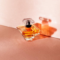 Lancôme Trésor golden juice glows inside the crystal bottle.