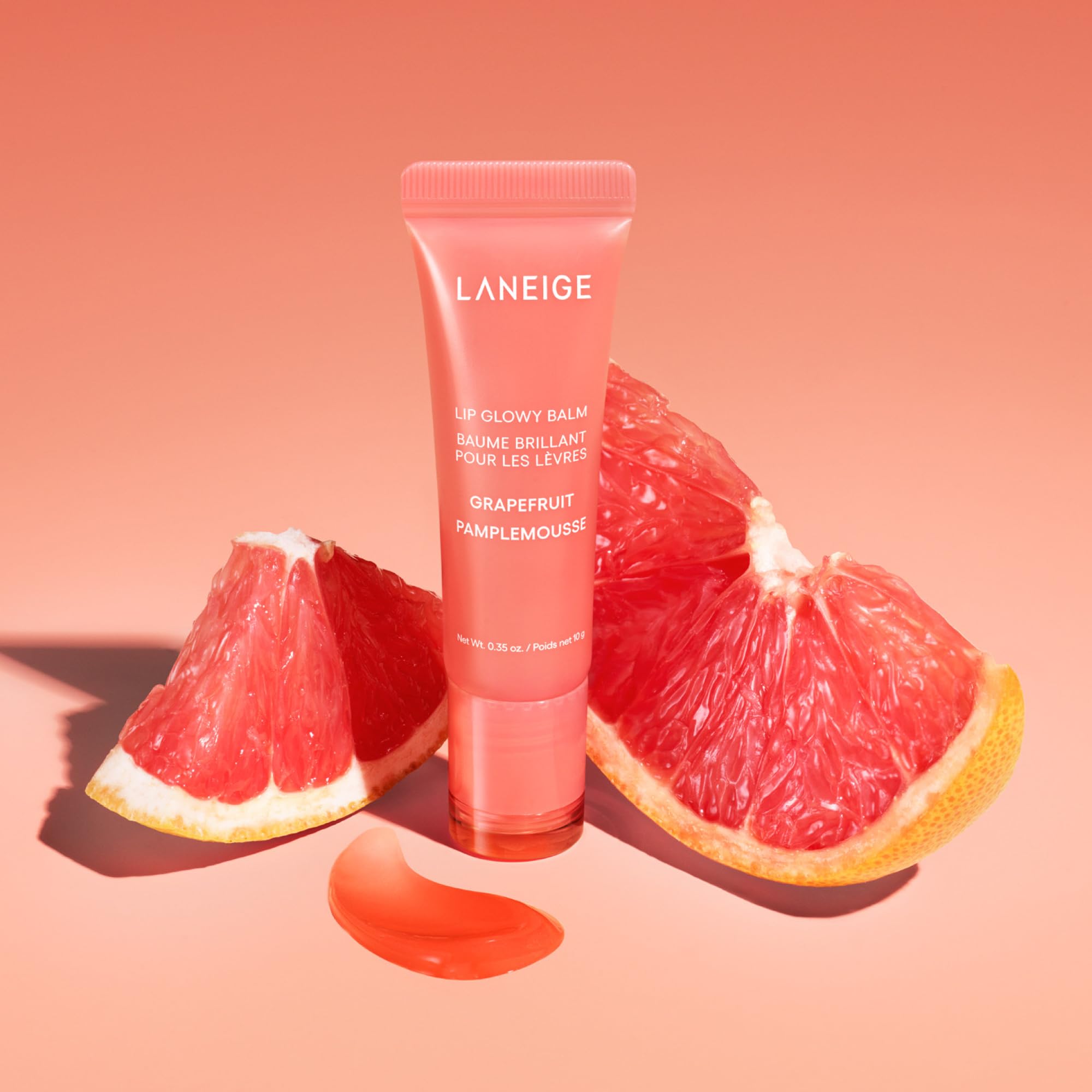 LANEIGE Lip Glowy Balm grapefruit swirl highlights sheer tint and moisture.