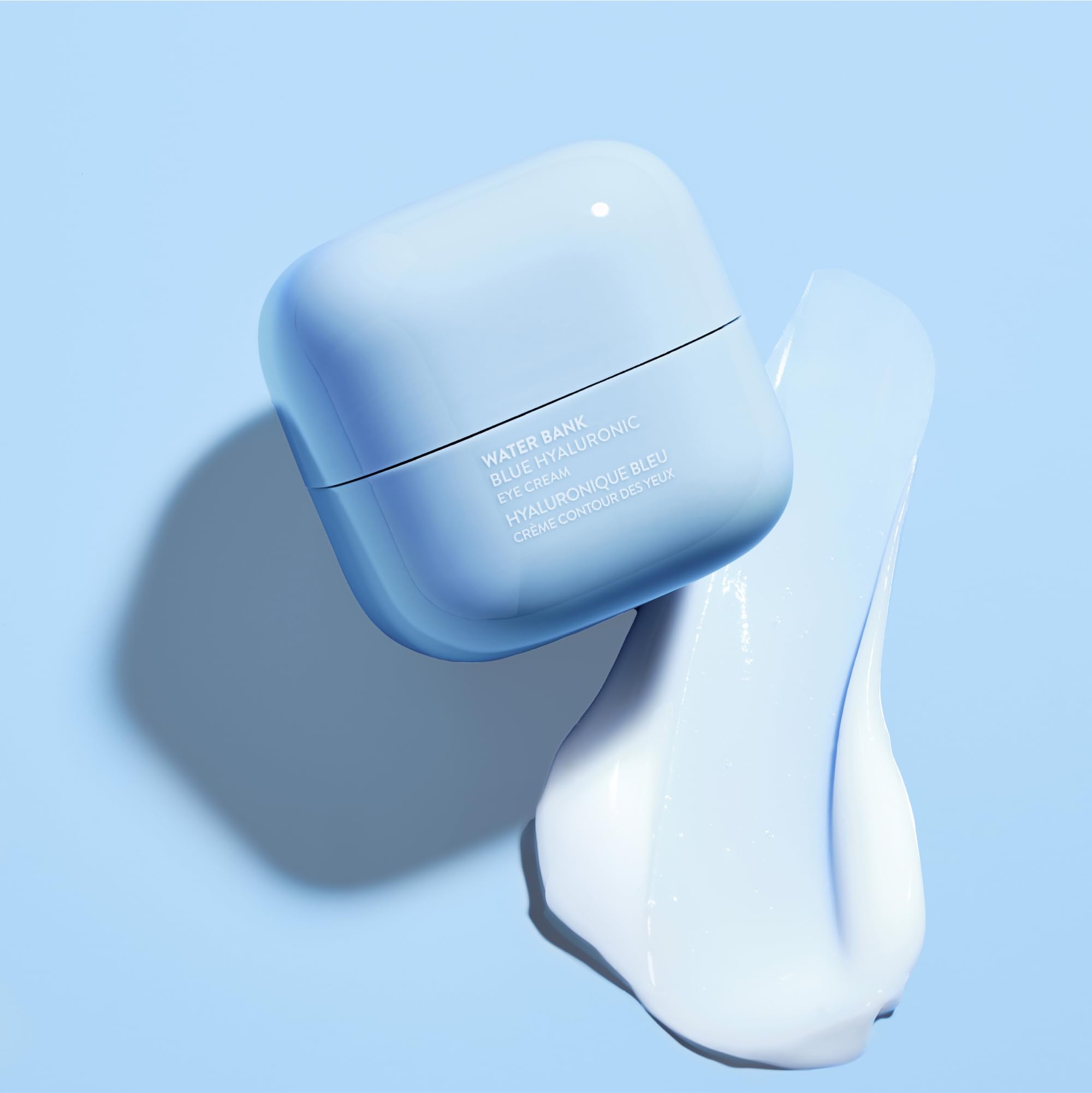 LANEIGE Water Bank Blue Hyaluronic Eye Cream jar close-up shows creamy texture for under-eye hydration