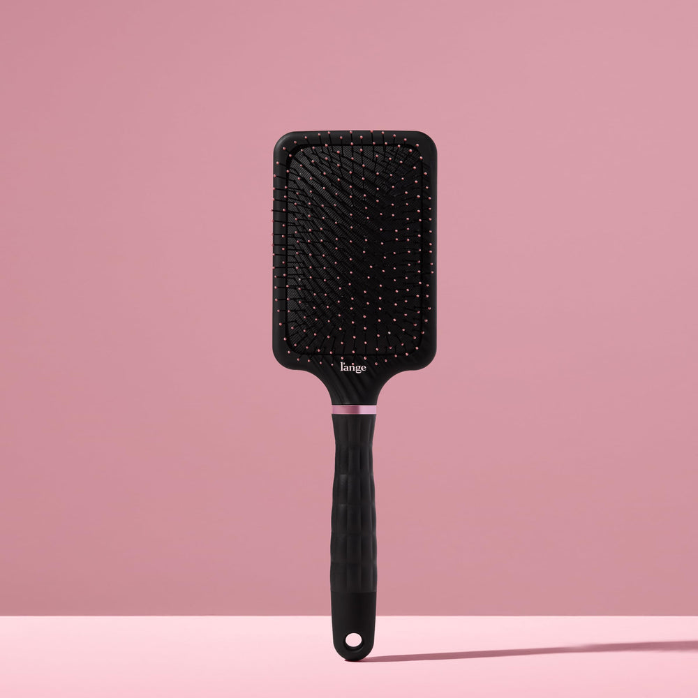L'ANGE HAIR detangling brush works on damp or dry hair.