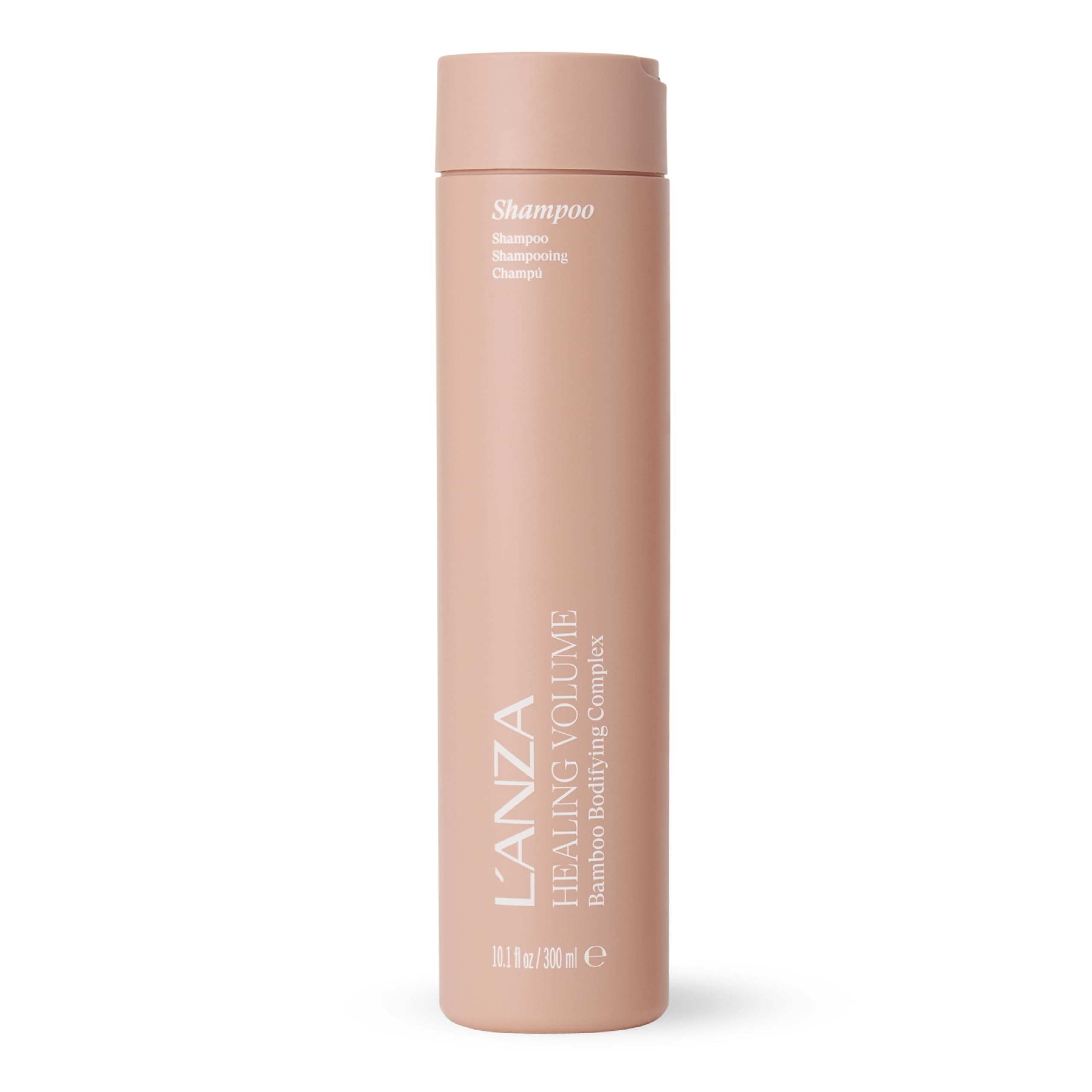 L’ANZA Healing Volume Thickening Shampoo bottle on a shelf shows fullness boost for fine hair.