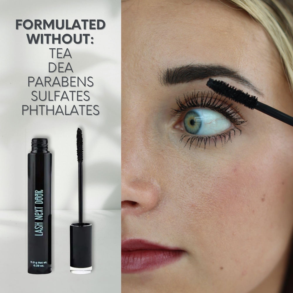Lash Next Door Water Resistant Mascara brush applying for smooth coverage.
