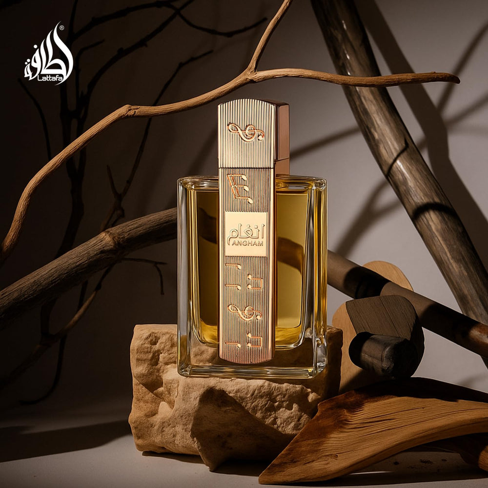 Lattafa Angham liquid in glass demonstrates clear fragrance essence.