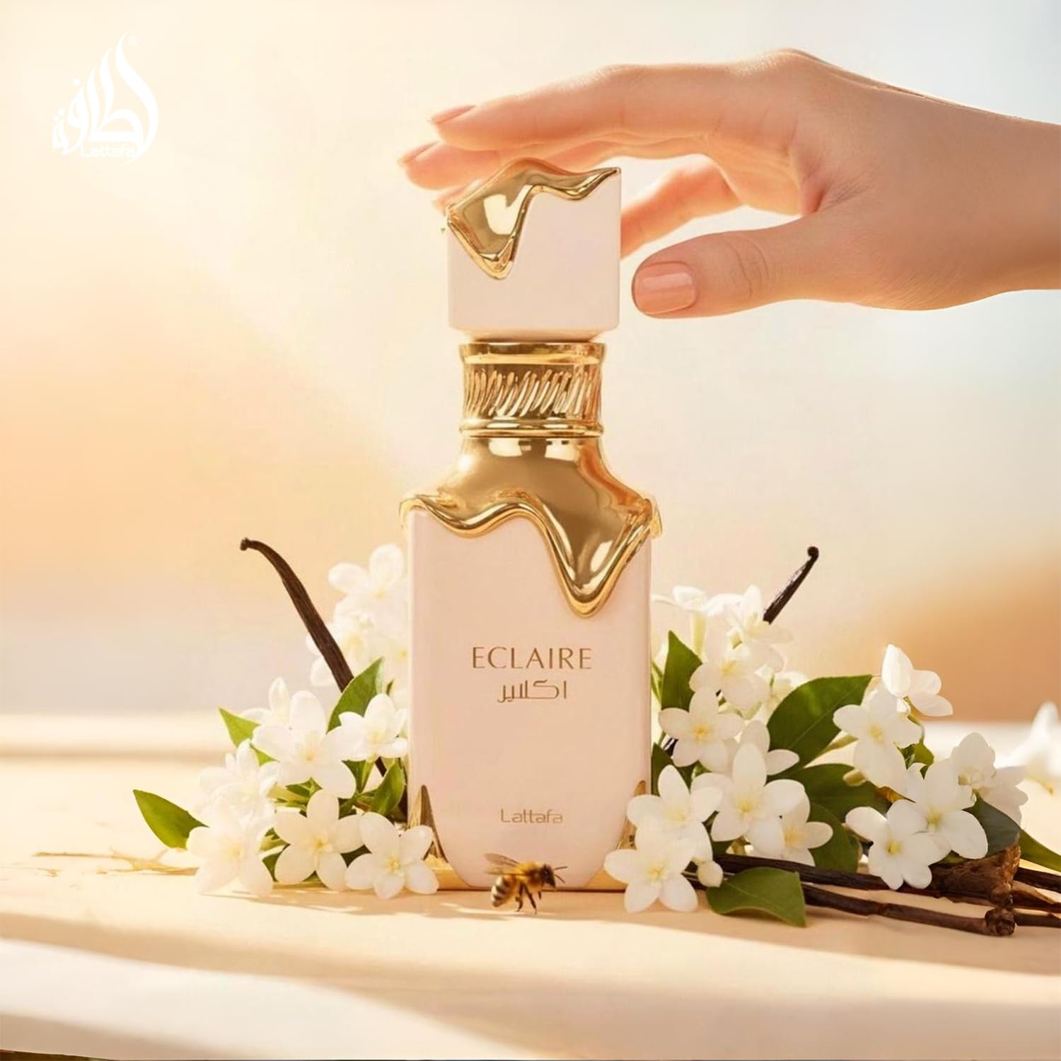 Lattafa Eclaire bottle swirl highlights caramel and milk ambiance.